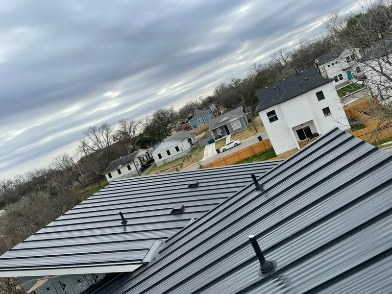 Standing seam metal roof panels with vents for Skylight Repair in Oatfield